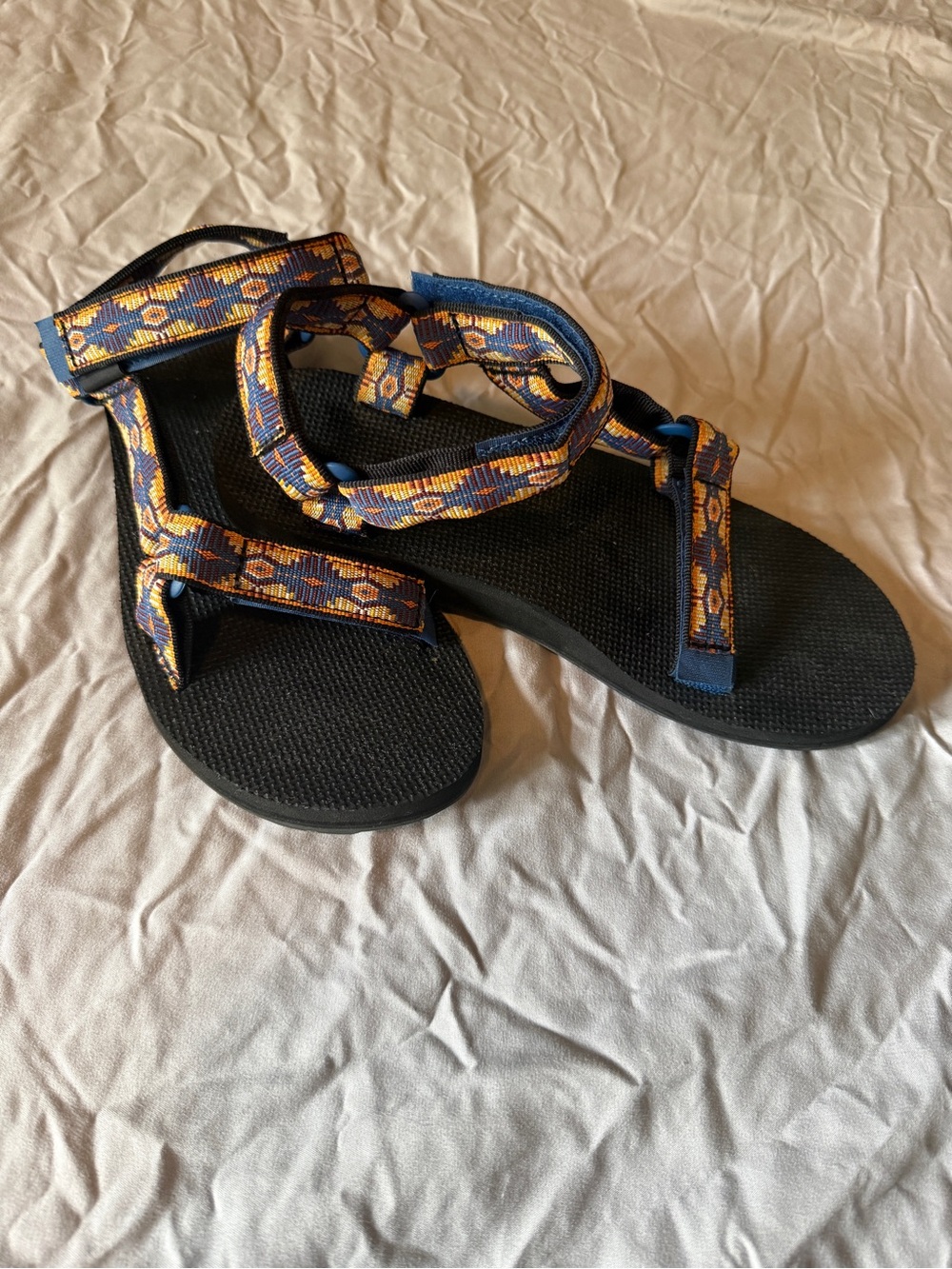 Teva Black Sandals with Blue and Yellow Patterned Straps